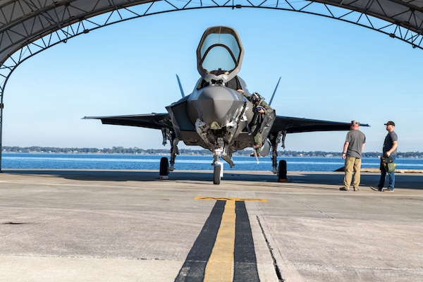 A Royal Navy (RN) F-35 Lightning II pilot debarks the aircraft after arriving at Fleet Readiness Center Southeast (FRCSE). The fifth-generation fighter is one of three aircraft from the RN that will undergo a Production Asset Inspection Requirement Tier II (PAIR II) corrosion-mitigation inspection at FRCSE.