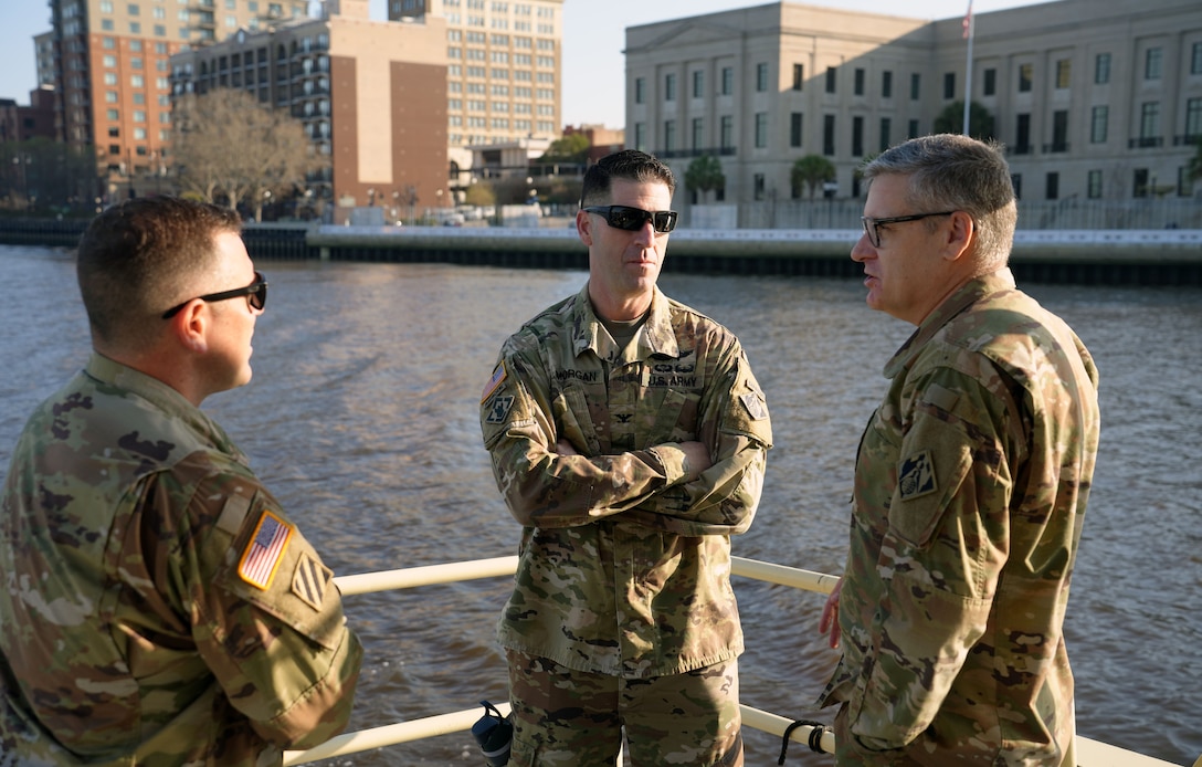 Three soldiers standing on Survey Vessel
