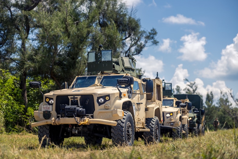 U.S. Marine Corps Joint Light Tactical Vehicles prepare to embark onto a U.S. Navy landing craft, air cushion in support of the 31st Marine Expeditionary Unit at Kin Blue Training Area, Okinawa, Japan, Aug. 13, 2024. U.S. Marines with 3d Battalion, 12th Marine Littoral Regiment attached High Mobility Artillery Rocket Systems to the 31st MEU. 3/12 integration with the 31st MEU demonstrates the ability to execute Expeditionary Advanced Base Operations and the flexibility to rapidly respond to crises and contingencies. The 31st MEU is operating aboard ships of the America Amphibious Ready Group in the 7th Fleet area of operations to enhance interoperability with allies and partners and serve as a ready response force to defend peace and stability in the Indo-Pacific region. (U.S. Marine Corps photo by Lance Cpl. Matthew Morales)