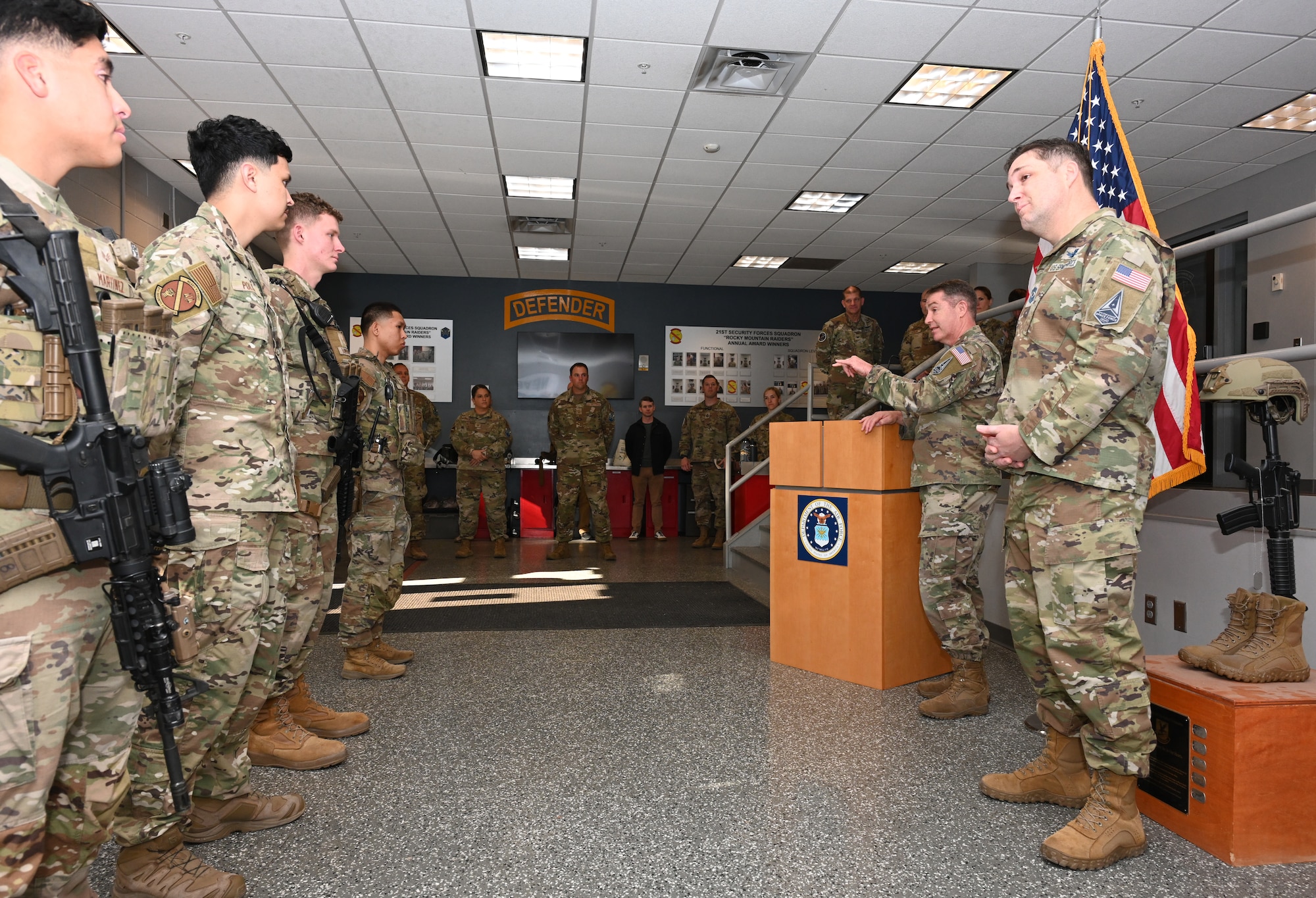 21st Forces members stand in formation while Combat Forces Command leadership addresses them while Space Base Delta 1 leadership stands in the background during the recognition ceremony.
