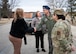 House Armed Services Committee staff members are greeted by U.S. Air Force Col. Thomas Taylor.
