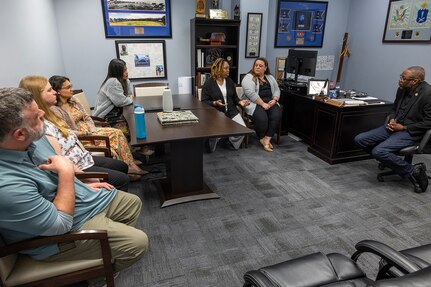 Six U.S. Army Financial Management Command Army Military Pay Office employees meet with Gennaro Penn, USAFMCOM Military Pay Operations director, pictured far right, at the Maj. Gen. Emmett J. Bean Federal Center in Indianapolis March 20, 2026. Ten AMPO employees visited USAFMCOM headquarters after attending a reserve pay course, sponsored by the U.S. Army Reserve Center, from March 16-20, 2026, in Indianapolis with the primary objective of enhancing the student’s the military pay knowledge on Army Reserve and Army National Guard pay in the AMPO network. (U.S. Army photo by Mark R. W. Orders-Woempner)