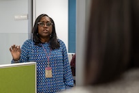 Kay Meadoh, Defense Finance and Accounting Service supervisory finance specialist, briefs Army Military Pay Office employees at the Maj. Gen. Emmett J. Bean Federal Center in Indianapolis March 20, 2026. After completing a reserve pay course, the AMPO employees toured both the U.S. Army Financial Management Command’s headquarters and DFAS to gain a better understanding of how the two organizations work together to support Soldiers and their families across the Army. (U.S. Army photo by Mark R. W. Orders-Woempner)