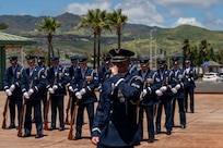 U.S. Air Force Senior Airman Zackery Easley, U.S. Air Force Honor Guard ceremonial guardsman, narrates a drill team performance at Kapolei High School, Kapolei, Hawaii, March 30, 2026. The team engaged with Kapolei’s U.S. Marine Corps Junior Reserve Officer Training Corps cadets over the weekend before performing for the entire high school. (U.S. Air Force photo by Staff Sgt. Jordan Powell)