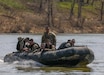 A Zodiac boat from the 2061st Multi-Role Bridge Company carry U.S. Army Reserve Soldiers competing in the 2026 Best Squad Competition at Fort Knox March 26. The MRBC assisted with the Salt River Live Fire Exercise that challenged the Reserves Soldiers to shoot while in a moving watercraft. (U.S. Army National Guard photos by Sgt. 1st Class Benjamin Crane)