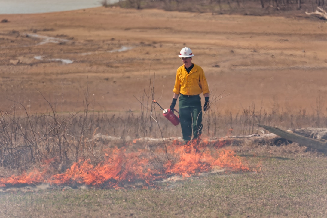 Louisville District Wildland Fire Program Manager Chris DeSmit, acting as burn leader, conducts a prescribed burn, March 25, 2026 at Barren River Lake in Glasgow, Ky. USACE crews conduct controlled burns during the dormant season to systematically reduce accumulated vegetation and restore native plant life across district lake projects.