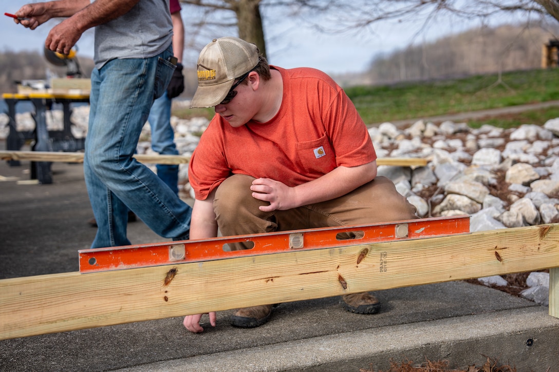 Students from the Northeast Dubois High School Building and Trades class reconstruct a wooden fence and railing at a scenic overlook, March 31, 2026 at Patoka Lake in Dubois, Indiana. The class coordinated with the U.S. Army Corps of Engineers, Louisville District and lake staff to replace the aging infrastructure. The project provides students with hands-on construction experience while fostering community ownership.
