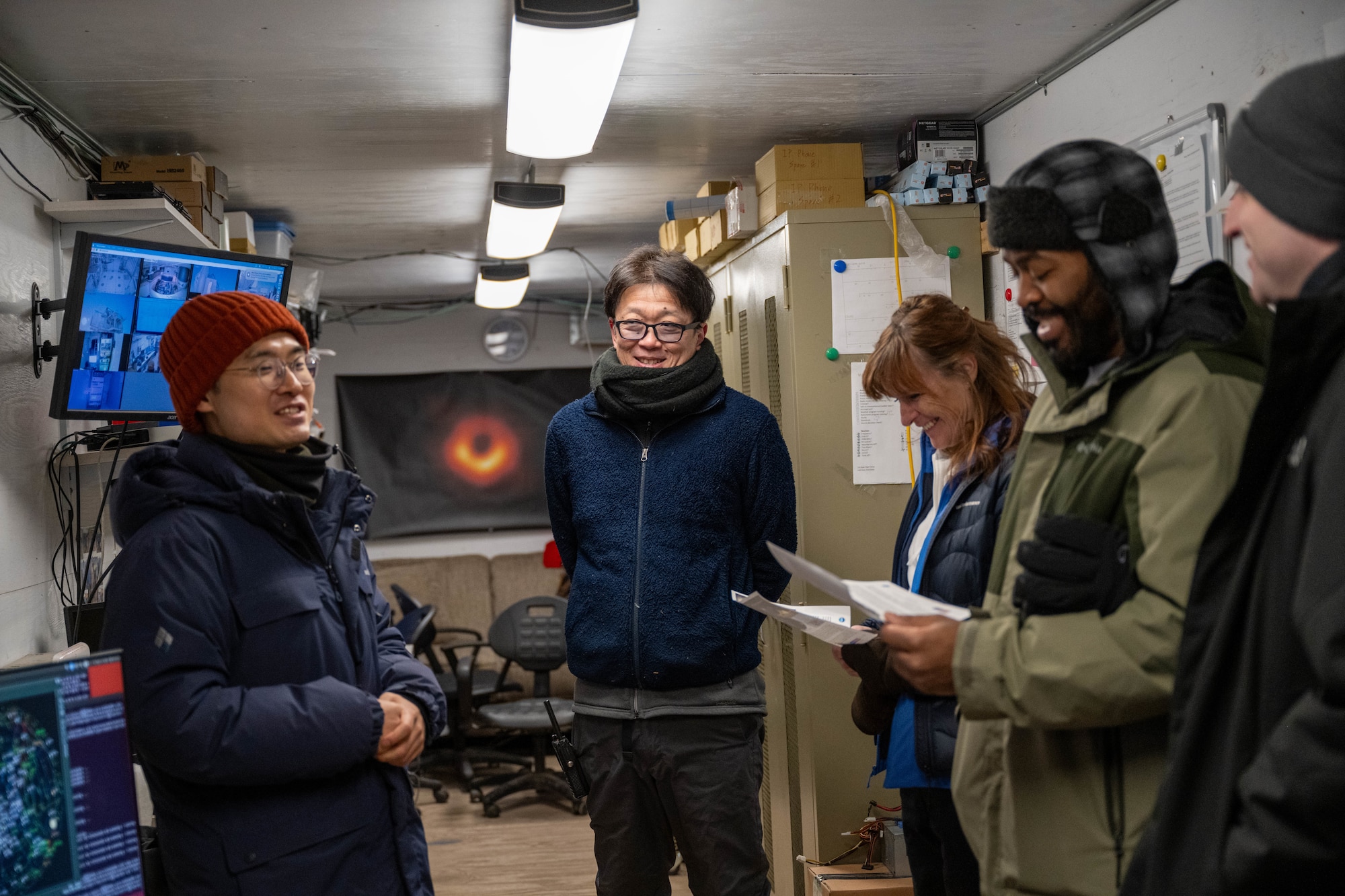 Individuals speak to visitors at Pituffik Space Base.