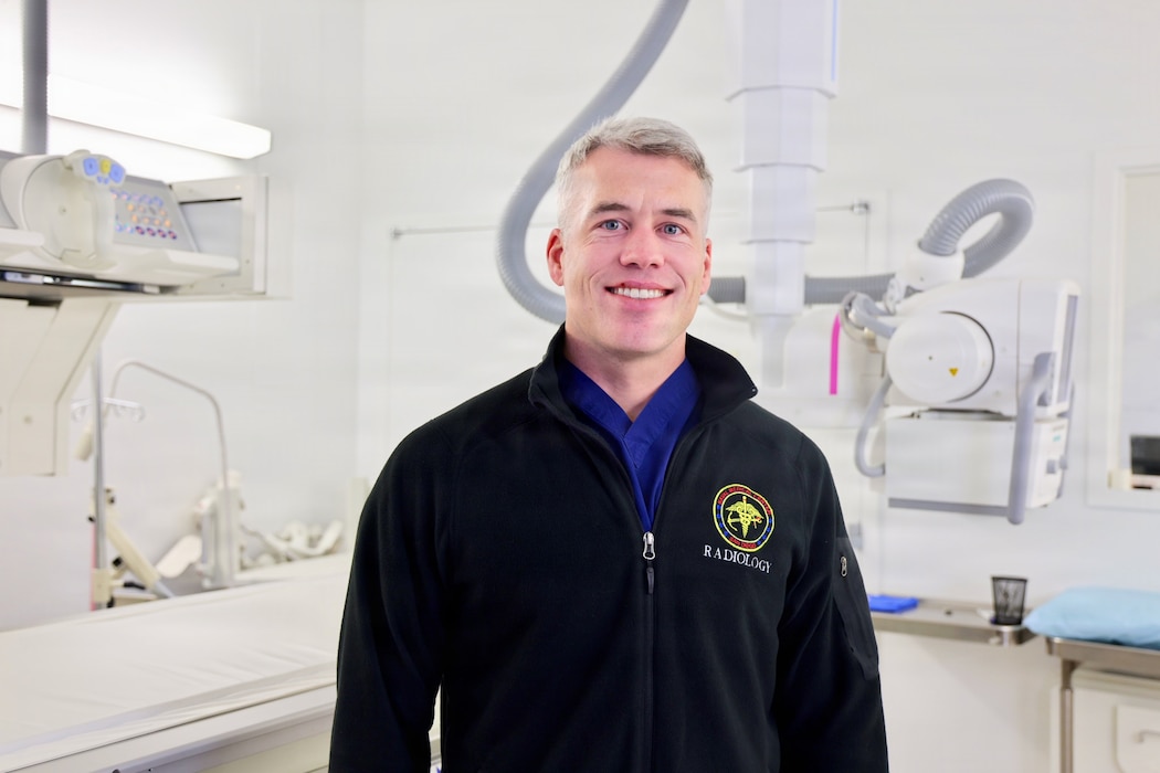 Lt. Cmdr. Brandon DuGar, a radiologist assigned to Navy Medicine Readiness and Training Command Twentynine Palms, poses for a photo in the radiology department at Naval Hospital Twentynine Palms, April 2, 2026. DuGar was named Navy Medicine’s Junior Radiologist of the Year on March 24, 2026, recognizing his clinical excellence and contributions to patient care and operational readiness. (U.S. Navy photo by Christopher Jones, NMRTC/NH Twentynine Palms public affairs officer).