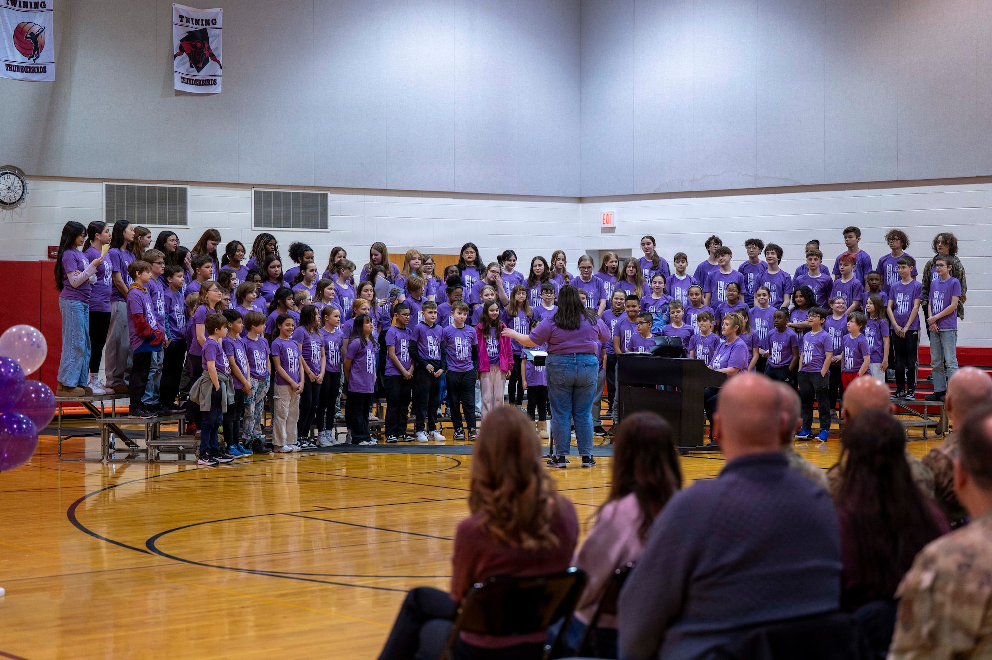 The Nathan Twining Elementary and Middle School fourth to eight grade choir perform the song “A Million Dreams” during a Month of the Military Child ceremony at Grand Forks Air Force Base, North Dakota, April 7, 2026.