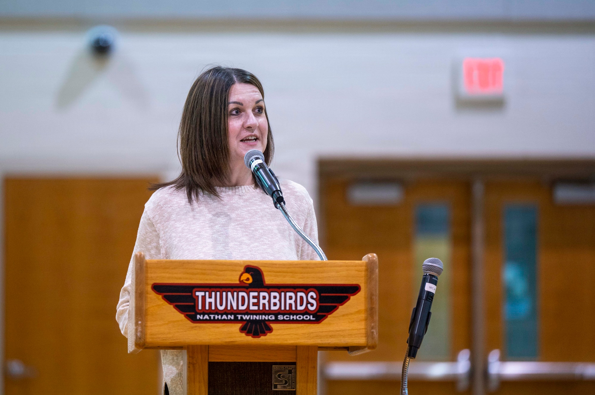 Mary Christy, field representative for the Governor of North Dakota, thanks children in the audience during a Month of the Military Child ceremony at Grand Forks Air Force Base, North Dakota, April 7, 2026.