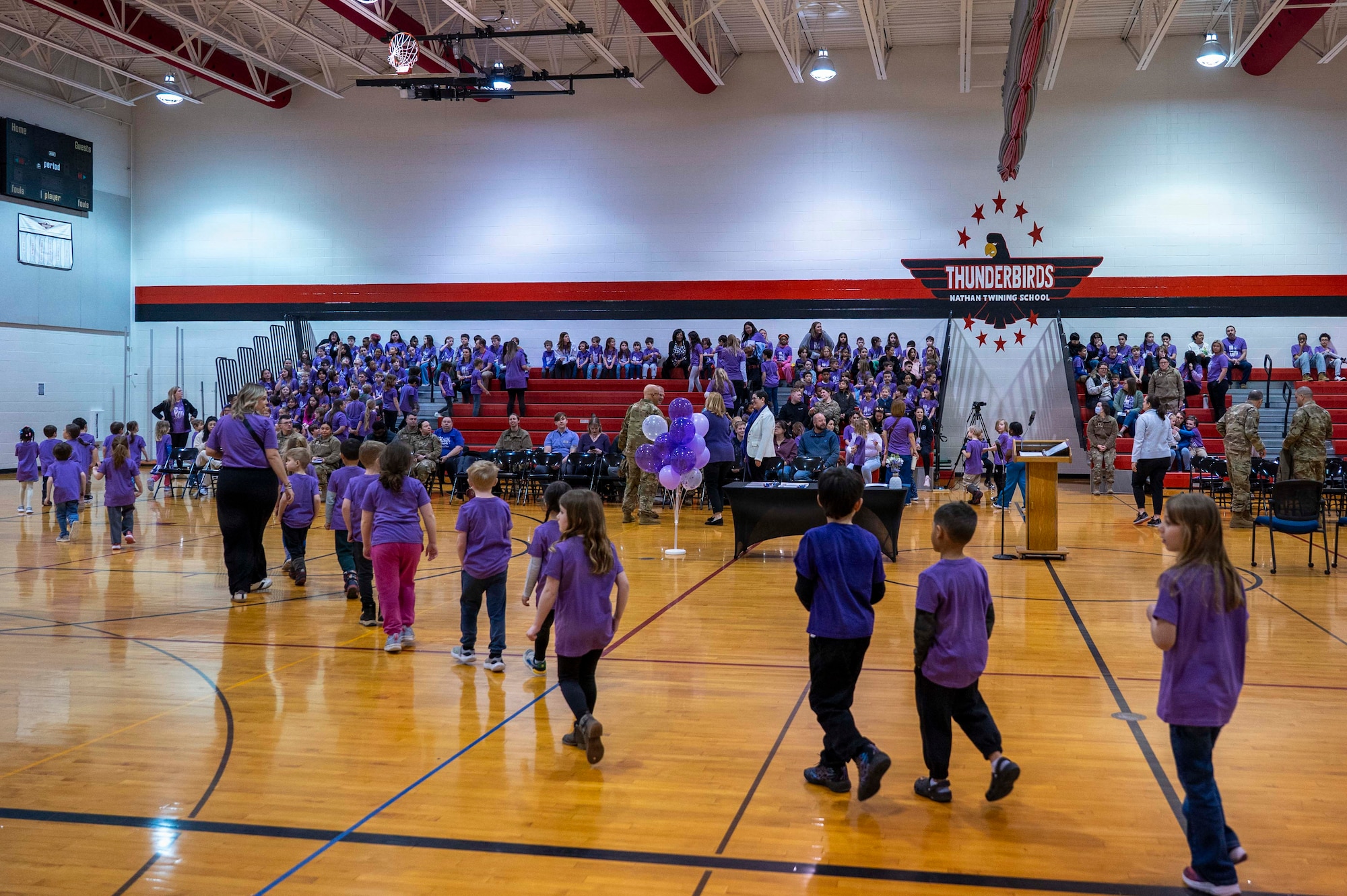 Children from the Nathan Twining Elementary and Middle School fill the gymnasium during a Month of the Military Child ceremony at Grand Forks Air Force Base, North Dakota, April 7, 2026.
