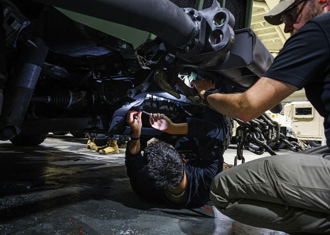 A U.S. Marine assigned to I Marine Expeditionary Force and a contractor with the Blount Island Command technical assistance and advisory team conduct pre-operation checks and services on a Joint Light Tactical Vehicle March 8, 2026, aboard the USNS Sgt. William W. Seay in the Philippine Sea. The checks and services were in preparation for a maritime prepositioning force offload at the Port of Cagayan de Oro, Philippines, in support of Exercise Balikatan 26. Balikatan is a longstanding annual exercise between the Armed Forces of the Philippines and U.S. military designed to strengthen the ironclad alliance, improve combined capabilities and demonstrate commitment to regional security and stability. (U.S. Marine Corps photo by Cpl. Nicholas Martinez)