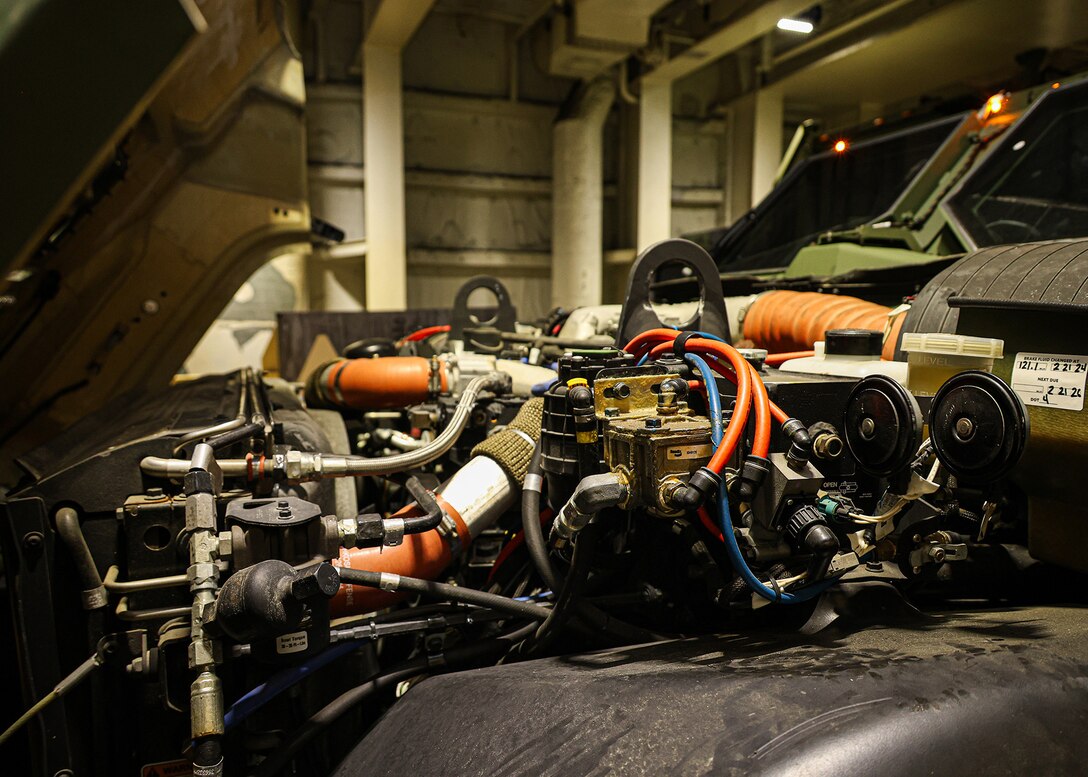 A U.S. Marine assigned to I Marine Expeditionary Force and a contractor with the Blount Island Command technical assistance and advisory team conduct pre-operation checks and services on a Joint Light Tactical Vehicle March 8, 2026, aboard the USNS Sgt. William W. Seay in the Philippine Sea. The checks and services were in preparation for a maritime prepositioning force offload at the Port of Cagayan de Oro, Philippines, in support of Exercise Balikatan 26. Balikatan is a longstanding annual exercise between the Armed Forces of the Philippines and U.S. military designed to strengthen the ironclad alliance, improve combined capabilities and demonstrate commitment to regional security and stability. (U.S. Marine Corps photo by Cpl. Nicholas Martinez)