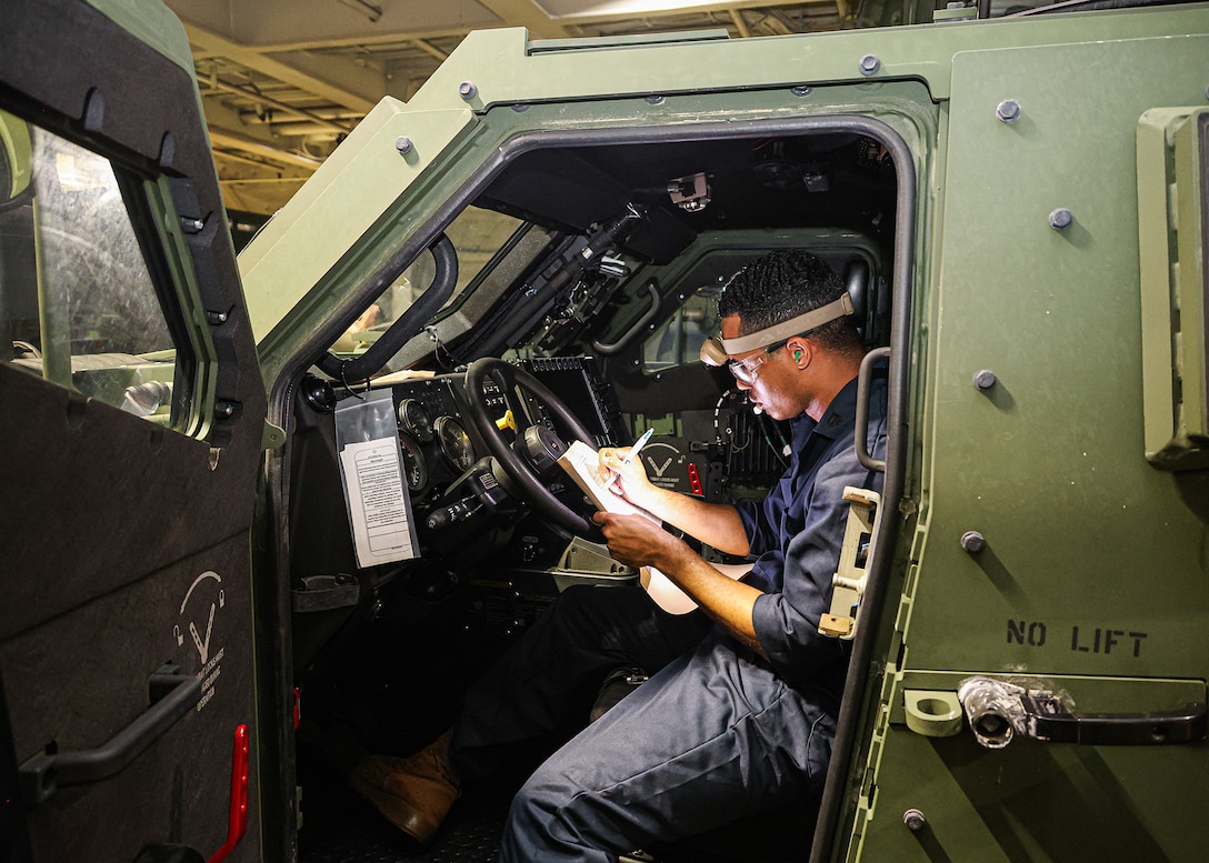 A U.S. Marine assigned to I Marine Expeditionary Force conducts pre-operation checks and services on a Joint Light Tactical Vehicle March 8, 2026, aboard the USNS Sgt. William W. Seay in the Philippine Sea. The checks and services were in preparation for a maritime prepositioning force offload at the Port of Cagayan de Oro, Philippines, in support of Exercise Balikatan 26. Balikatan is a longstanding annual exercise between the Armed Forces of the Philippines and U.S. military designed to strengthen the ironclad alliance, improve combined capabilities and demonstrate commitment to regional security and stability. (U.S. Marine Corps photo by Cpl. Nicholas Martinez)