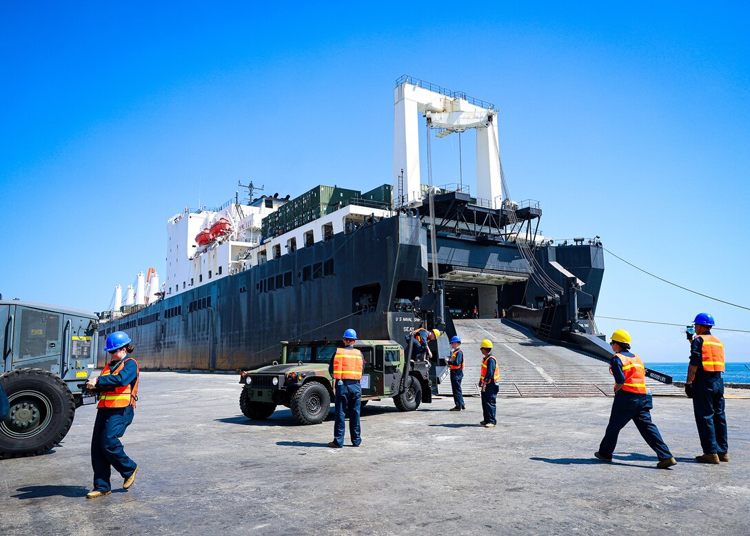 U.S. Marines assigned to I Marine Expeditionary Force stage vehicles during a maritime prepositioning force offload March 14, 2026, at the Port of Cagayan de Oro, Philippines. The operation supported the rapid distribution of forward-positioned equipment for Exercise Balikatan 2026 and demonstrated how prepositioning processes support distributed sustainment by conducting offload, distribution and regeneration across afloat platforms, ashore nodes and transportation networks. Balikatan is a longstanding annual exercise between the Armed Forces of the Philippines and the U.S. military designed to strengthen the alliance, improve combined capabilities and demonstrate commitment to regional security and stability. (U.S. Marine Corps photo by Cpl. Nicholas Martinez)