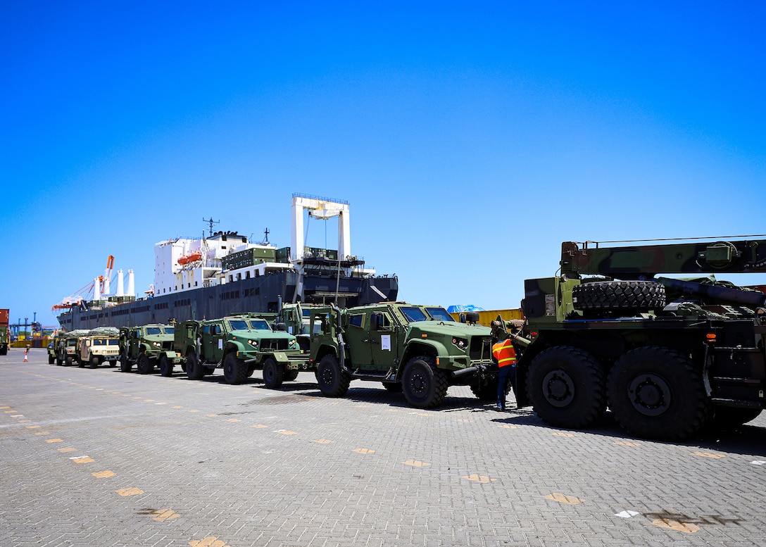 U.S. Marines assigned to I Marine Expeditionary Force stage vehicles during a maritime prepositioning force offload March 14, 2026, at the Port of Cagayan de Oro, Philippines. The operation supported the rapid distribution of forward-positioned equipment for Exercise Balikatan 2026 and demonstrated how prepositioning processes support distributed sustainment by conducting offload, distribution and regeneration across afloat platforms, ashore nodes and transportation networks. Balikatan is a longstanding annual exercise between the Armed Forces of the Philippines and the U.S. military designed to strengthen the alliance, improve combined capabilities and demonstrate commitment to regional security and stability. (U.S. Marine Corps photo by Cpl. Nicholas Martinez)