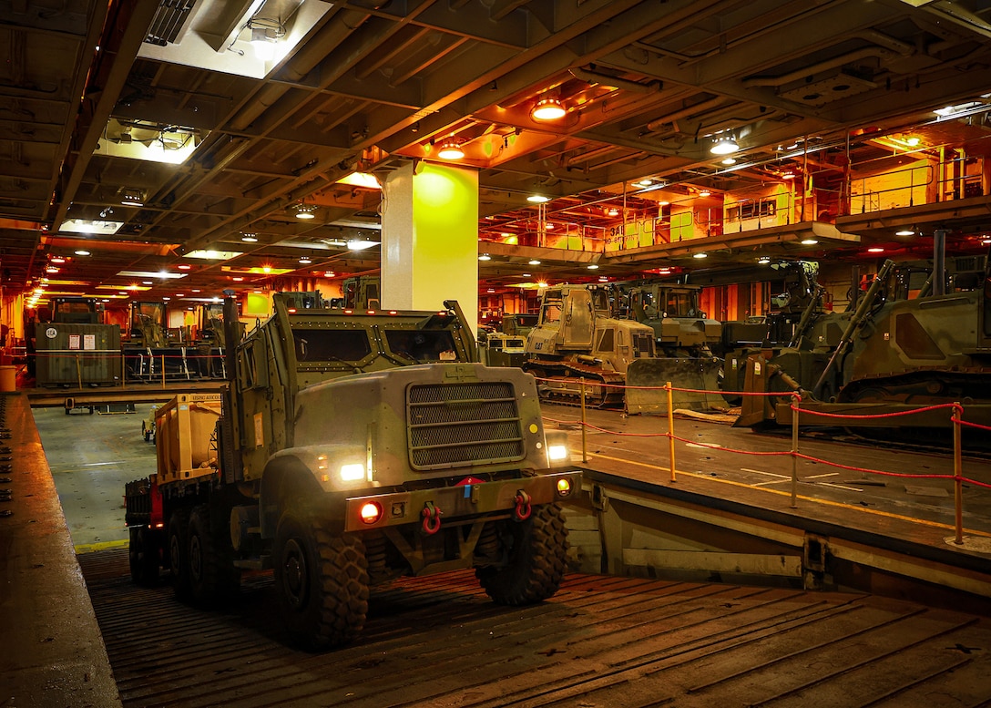 U.S. Marines assigned to I Marine Expeditionary Force offload vehicles from the USNS Sgt. William W. Seay during a maritime prepositioning force offload March 14, 2026, at the Port of Cagayan de Oro, Philippines. The operation supported the rapid distribution of forward-positioned equipment for Exercise Balikatan 2026 and demonstrated how prepositioning processes support distributed sustainment by conducting offload, distribution and regeneration across afloat platforms, ashore nodes and transportation networks. Balikatan is a longstanding annual exercise between the Armed Forces of the Philippines and the U.S. military designed to strengthen the alliance, improve combined capabilities and demonstrate commitment to regional security and stability. (U.S. Marine Corps photo by Cpl. Nicholas Martinez)