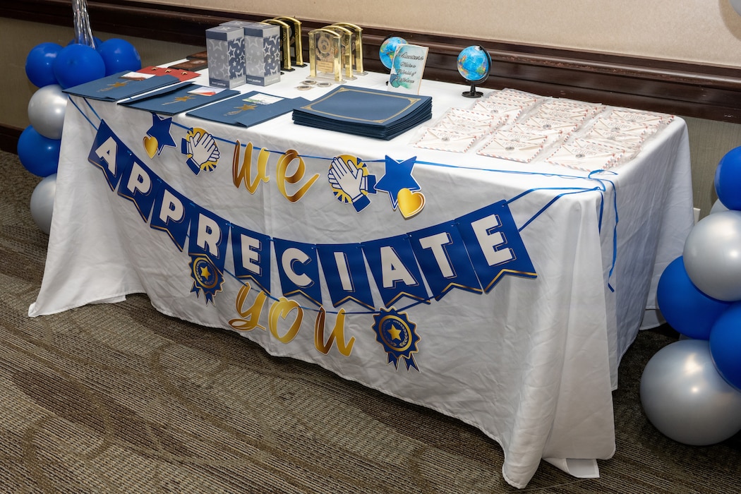 Awards and coins displayed on a table