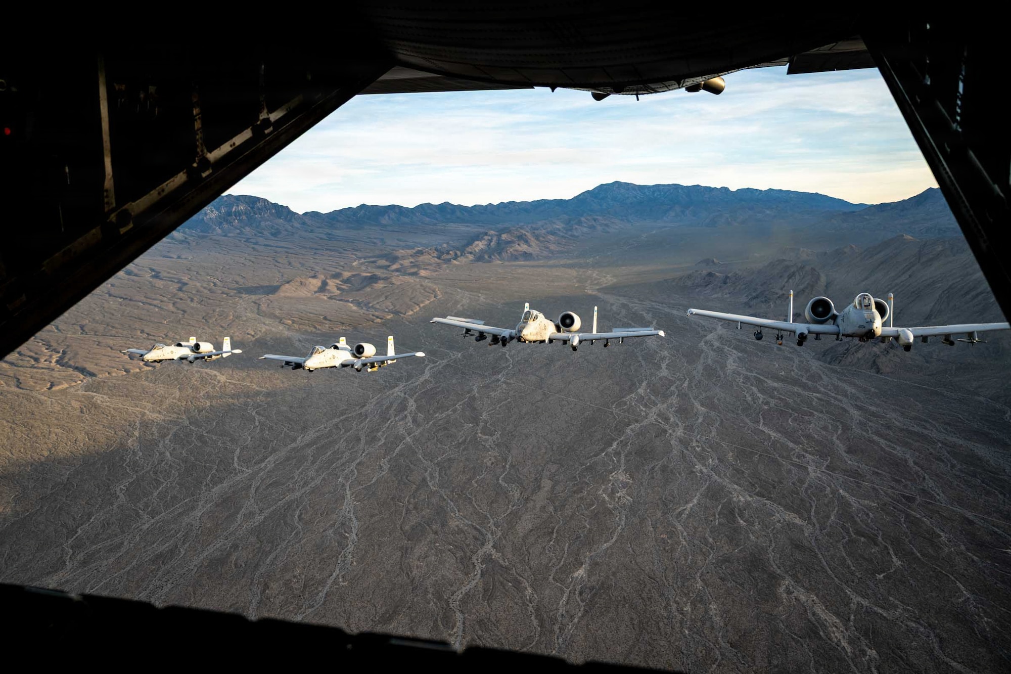 A group of U.S. Air Force A-10 Thunderbolt II fly over Nevada during a training mission.