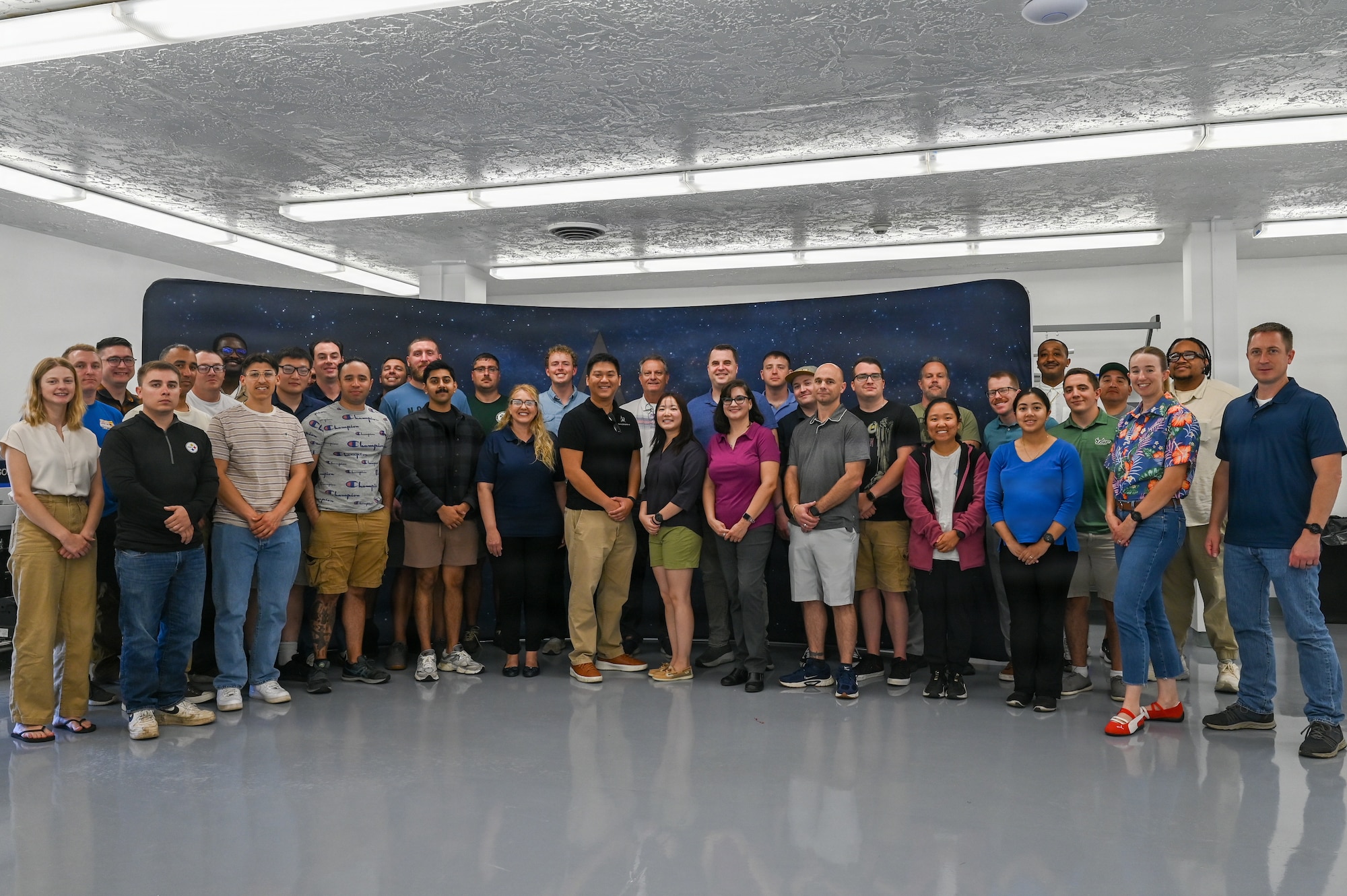 2nd Space Launch Squadron personnel pose for a group photo at The Crucible innovation lab.