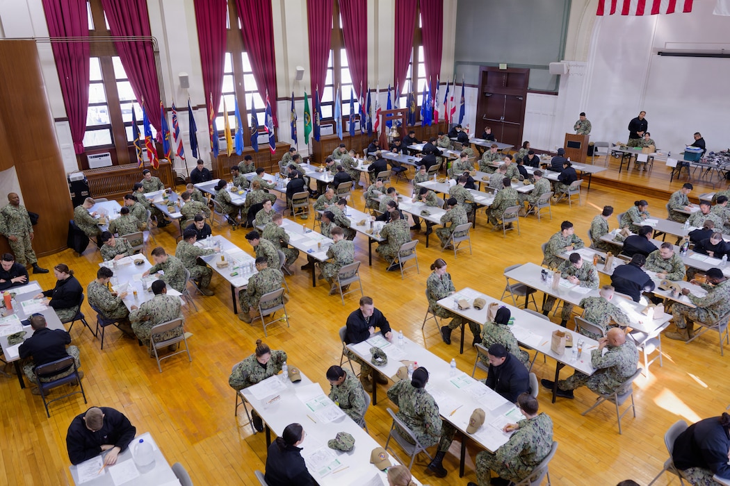 YOKOSUKA, Japan (March 12, 2026) — A group of petty officers third class takes the E-5 Navy-Wide Advancement Exam (NWAE) at Commander, Fleet Activities Yokosuka’s C2 Auditorium. The NWAE is a biannual exam that tests Sailors’ rating-specific knowledge for advancement to the next paygrade. (U.S. Navy photo by Mass Communication Specialist 2nd Class Quinton A. Lee)