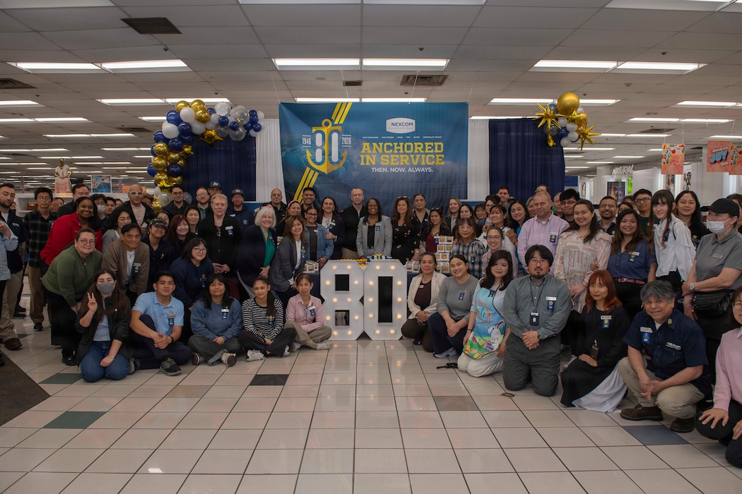 YOKOSUKA, Japan (April 1, 2026) - The Yokosuka Navy Exchange (NEX) store employees pose for a photo during the Navy Exchange Service Command's (NEXCOM) 80th birthday at the operation's main store onboard Commander, Fleet Activities Yokosuka, Japan, April 1, 2026. NEXCOM enhances warfighter readiness and strengthens the Navy’s quality-of-life mission. (U.S. Navy photo by Mass Communication Specialist 2nd Class Quinton A. Lee)