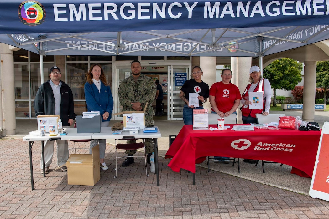 YOKOSUKA, Japan (April 6, 2026) – Commander, Fleet Activities Yokosuka’s (CFAY) Emergency Management team and American Red Cross volunteers pose for a group photo during CFAY’s April Emergency Preparedness Outreach on April 6, 2026. The event showcased how Emergency Management and American Red Cross Yokosuka support installation readiness by providing preparedness information, emergency resources and recovery support. (U.S. Navy photo by Mass Communication Specialist 2nd Class Quinton A. Lee)