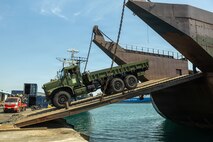 U.S. Marines assigned to I Marine Expeditionary Force and Philippine contractors onload a Medium Tactical Vehicle Replacement onto a Philippine barge in Cagayan de Oro, Philippines, March 17, 2026.