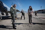 Sgt. First Class (ret.) Daniel Stamaris, Freedom Flyer #216, gets sprayed after flying on a T-38 Talon during his “champagne flight” during the Freedom Flyer Reunion at Joint Base San Antonio-Randolph, Texas, March 26, 2026. The reunion brings together former POWs, families, and military members to honor the sacrifices and enduring spirit of those who were held captive. The annual event traces its roots to the Vietnam War era, when repatriated service members were first recognized for their strength and perseverance following their return home. (U.S. Air Force photo by Sean Worrell)