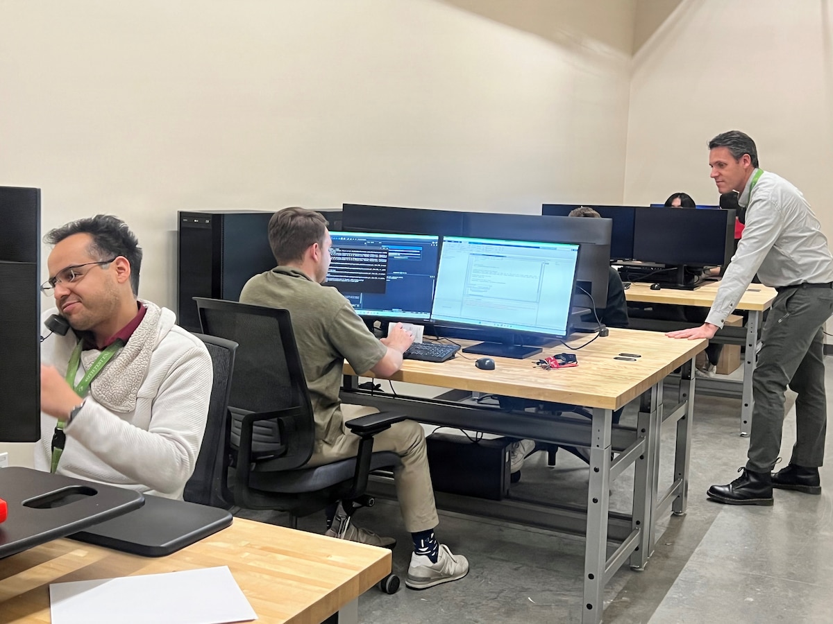 Victor Luquin, Robert Schickling and Alden Latkin, 773rd Test Squadron Airmen, utilize computer labs in the Flight Test Engineer Lab at Edwards AFB. (U.S. Air Force photo by Wendy Hashii).