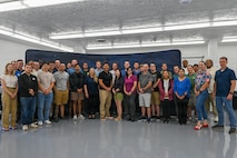 2nd Space Launch Squadron personnel pose for a group photo at The Crucible innovation lab.