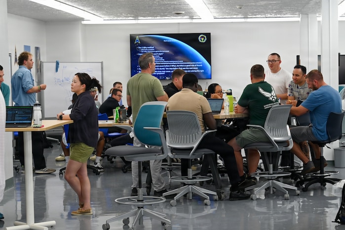 2nd Space Launch Squadron personnel discuss ideas in breakout teams during their first Innovation Days stand down event at The Crucible innovation lab.