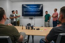 2nd Space Launch Squadron personnel brief their efficiency campaign ideas during their first Innovation Days stand down event at The Crucible innovation lab.