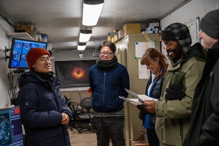 Individuals speak to visitors at Pituffik Space Base.