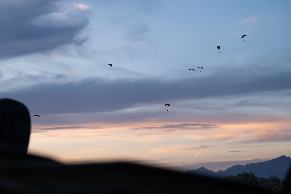U.S. Air Force Pararescuemen assigned to the 68th Rescue Squadron parachute during an exercise at Davis-Monthan Air Force Base, Arizona, April 3, 2026. The Pararescuemen participated in the Combat Leader Course, which trains Airmen in advanced rescue techniques and mission leadership. (U.S. Air Force photo by Airman 1st Class Jaden Kidd)