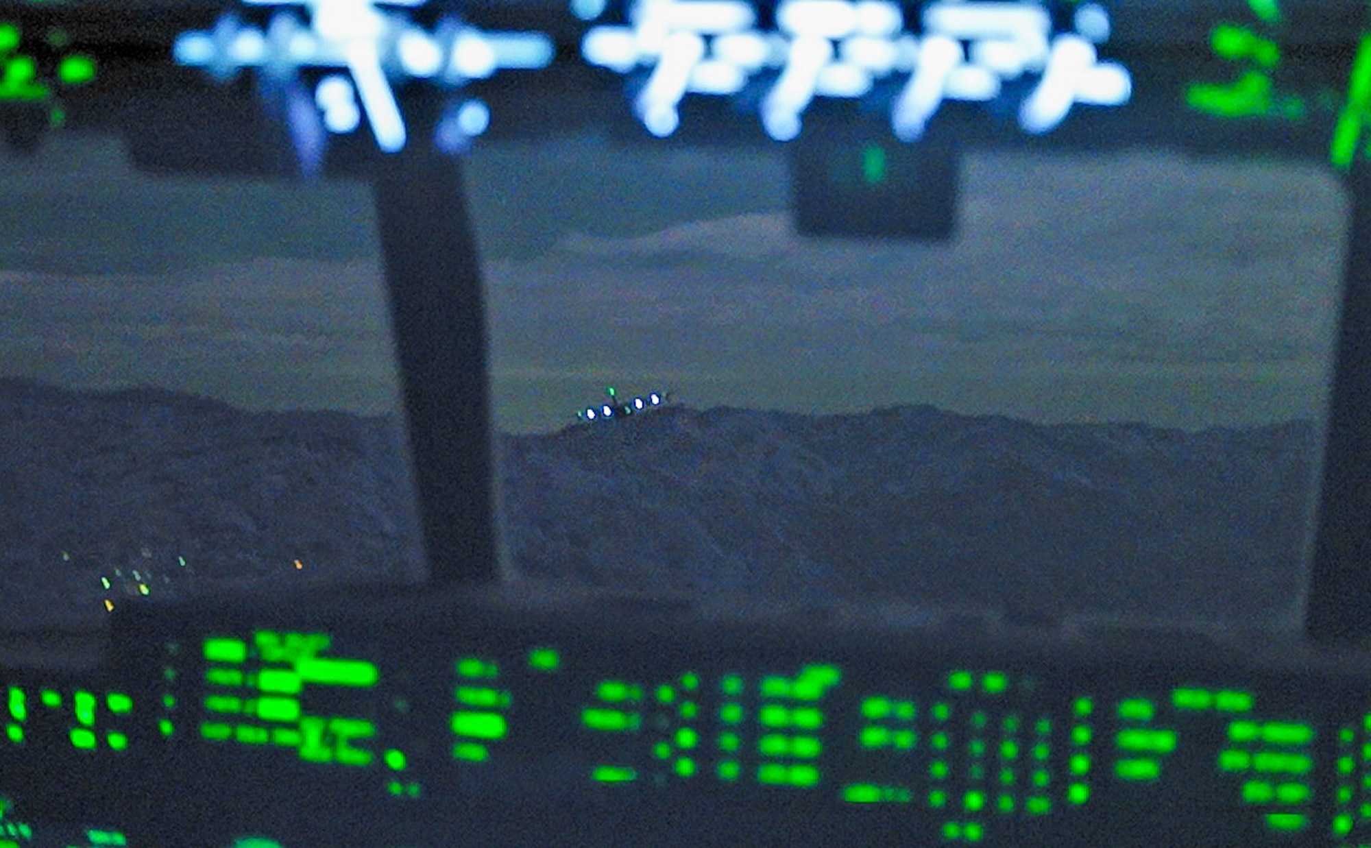 Two U.S. Air Force MC-130J Commando IIs assigned to the 353rd Special Operations Wing perform low level maneuvers over Fukuoka, Japan.