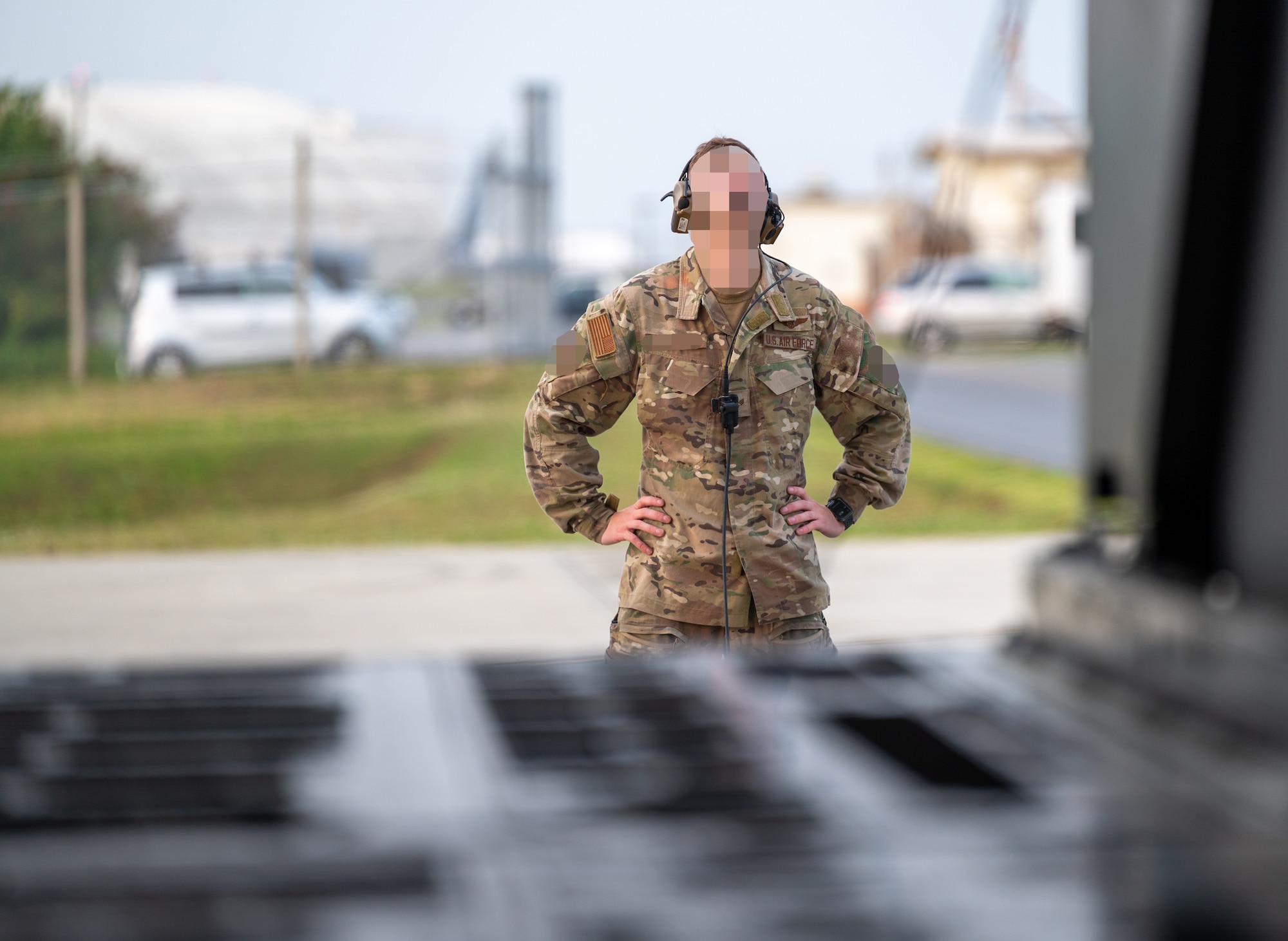 A U.S. Air Force loadmaster assigned to the 353rd Special Operations Wing performs preflight checks before takeoff at Kadena Air Base, Japan.