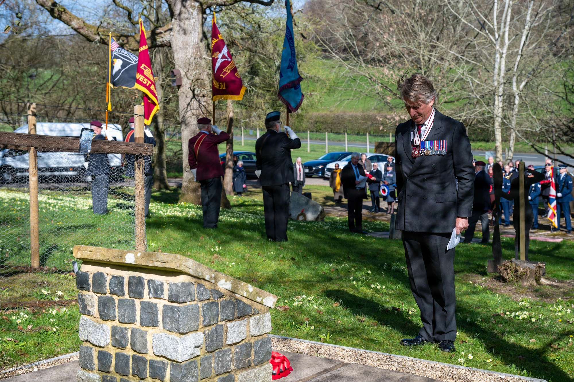 A community member pays respects during a memorial service