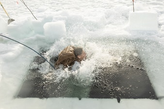 U.S. Navy Hospital Corpsman 1st Class Luis Esquivel, with 2nd Distribution Support Battalion, Combat Logistics Regiment 27, 2nd Marine Logistics Group, participates in a cold plunge near Elvegardsmoen, Norway, March 10, 2026. The training taught Marines and Sailors how to manage the effects of cold-water submersion and perform active rewarming procedures during exercise Cold Response 26. A key component of NATO's enhanced vigilance activity Arctic Sentry, exercise Cold Response 26 is a Norwegian-led winter military exercise designed to enhance collective defense capabilities and ensure U.S. readiness to rapidly deploy and seamlessly operate alongside NATO Allies in challenging arctic conditions. Esquivel is a native of Texas. (U.S. Marine Corps photo by Lance Cpl. Franco Lewis)