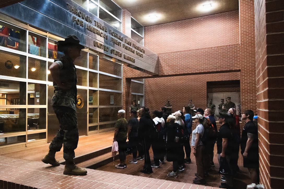 Educators with Recruiting Stations Nashville, Indianapolis, and Louisville, 4th Marine Corps District, stand at attention during educators workshop at Marine Corps Recruit Depot Parris Island, South Carolina, April 1, 2026. Educators Workshop provides an opportunity for high school teachers and school administrators to experience and gain insight into some of the challenges recruits face during Marine Corps recruit training. Attendees of the workshop can inform their students about the benefits and opportunities the Marine Corps can provide. (U.S. Marine Corps photo by Cpl. Allegra Catalan-Dyson).