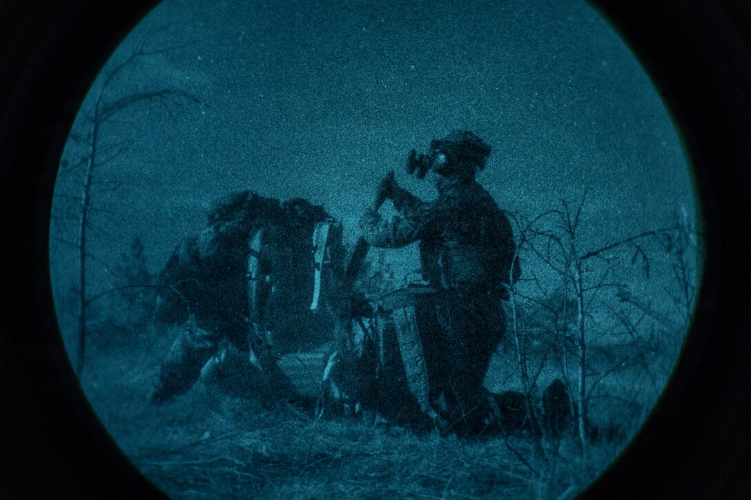U.S. Marine Corps Lance Cpl. Christina Reese, left, and Lance Cpl. Ethan Marsh, both mortarman with 3rd Battalion, 2nd Marine Regiment, 24th Marine Expeditionary Unit, load a M224 60mm  lightweight mortar system during a live-fire range on Marine Corps Base Camp Lejeune, North Carolina, April 1, 2026. The range strengthens the unit’s ability to maneuver in a dynamic training environment while enhancing combat effectiveness and overall readiness.  (U.S. Marine Corps photo by Lance Cpl. Allison White)