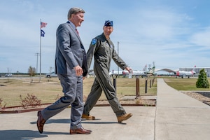 U.S. Rep. Mike Rogers, chairman of the House Armed Services Committee, walks with U.S. Air Force Brig. Gen. Michael Ferrario, assistant adjutant general for air, South Carolina, during a visit to McEntire Joint National Guard Base, South Carolina, March 24, 2026. The visit provided an opportunity to observe installation operations and gain insight into the South Carolina Air National Guard’s mission and readiness.