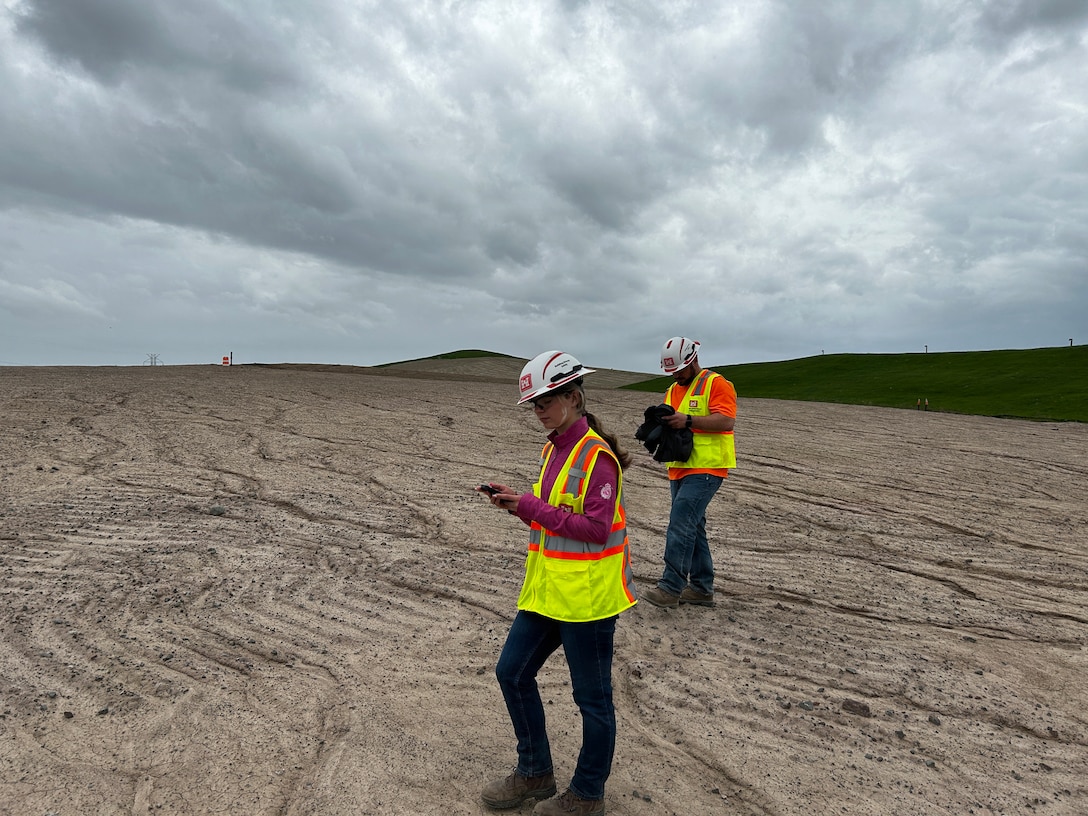 Engineered cap inspection by two Buffalo District engineers.