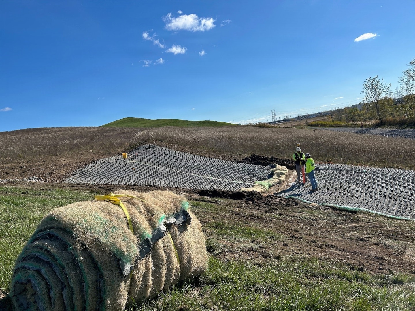 Restoration activities including drainage measures and installing erosion control bio-fabric.