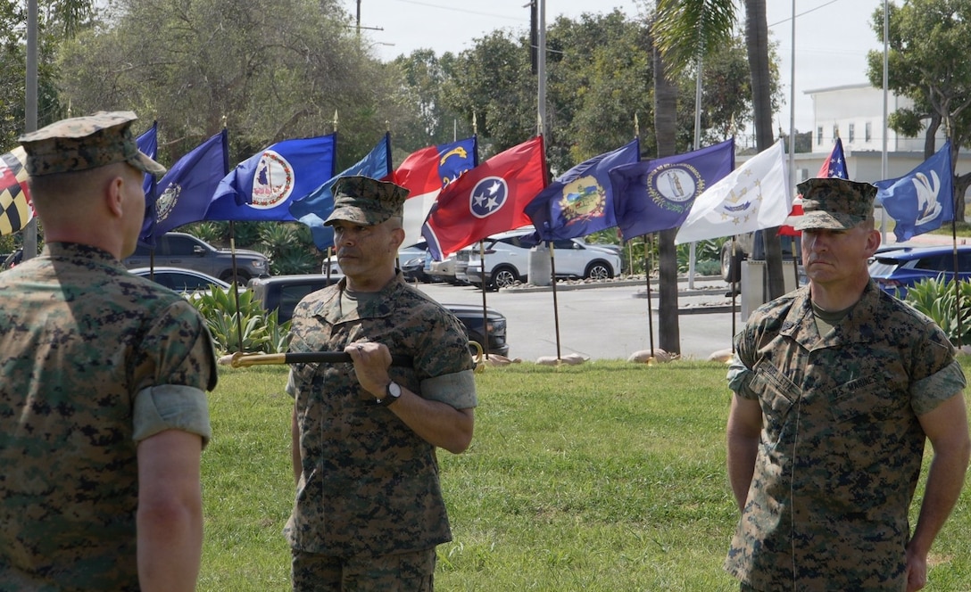 U.S. Marine Corps Sgt. Maj. Scott A. Johnson (left) relinquishes his duties as sergeant major of 5th Battalion, 14th Marine Regiment, 4th Marine Division, to Sgt. Maj. Eric P. Ouellette (right) during a relief and appointment ceremony at Seal Beach, California, March 22, 2026. The relief and appointment ceremony is a time-honored tradition that formally signifies the transfer of responsibility, authority, and accountability between senior enlisted leaders. (Courtesy Asset)