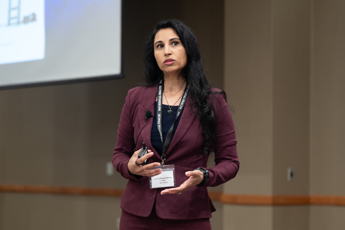 Image of a person speaking to a crowd.