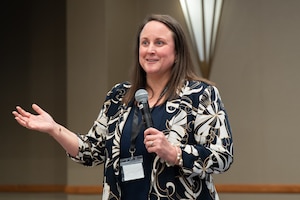 Image of a person speaking to a crowd.