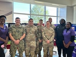 FORT BELVOIR, Va. (April 8, 2026)--Pubic Health team members of the Alexander T. Augusta Military Medical Center (ATAMMC) stand proudly while recognizing National Public Health Week during an exhibition April 6, 2026.
