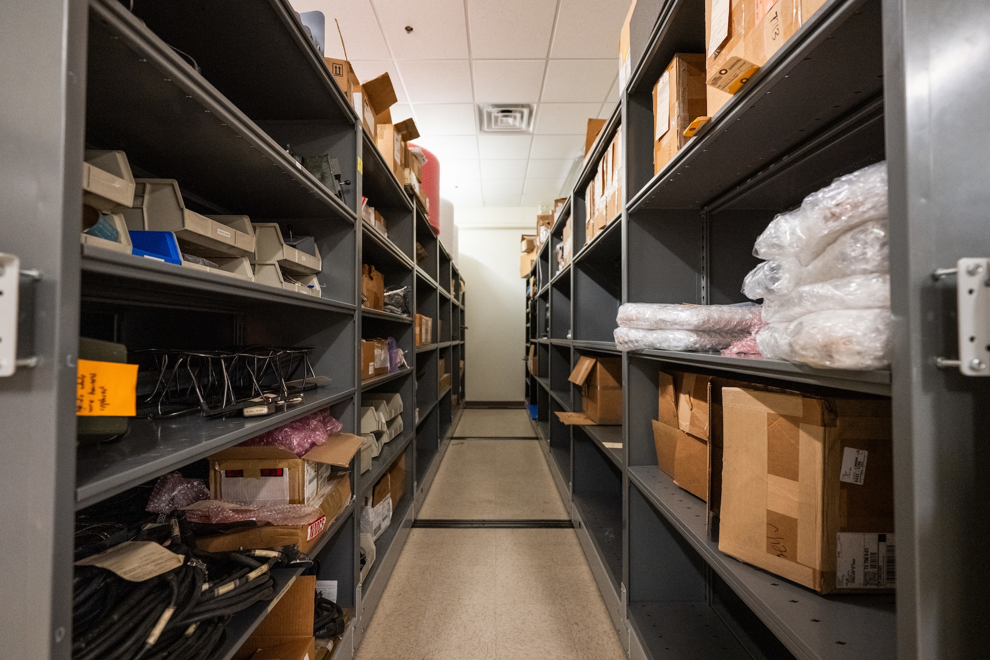 Air Force Repair Enhancement Program inventory is stored on shelves at Dyess Air Force Base, Texas, March 27, 2026.  AFREP technicians use these parts to repair and refurbish components, returning them to the supply system and supporting units across the installation. (U.S. Air Force photo by Airman 1st Class Caleb Schellenberg)
